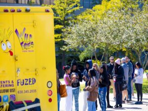 NIU Students wait in line for Wild Fries food truck.