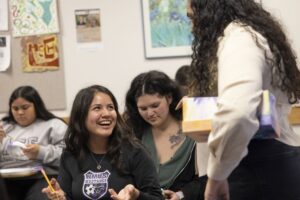 Artist Lorimar Matos speaks to students and leads an art-based activity at the Latino Resource Center.