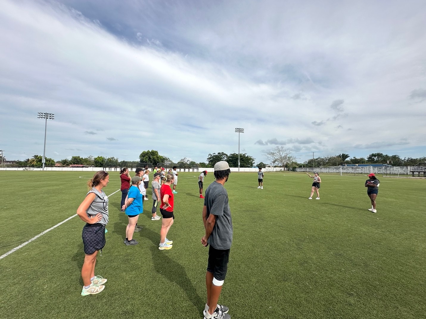 Three NIU students lead an activity for National Sports Council members and Peace Core volunteers.
