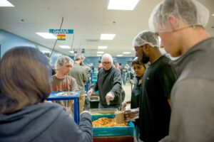 Students in the Philosophy of Food course pack meals for Feed My Starving Children.